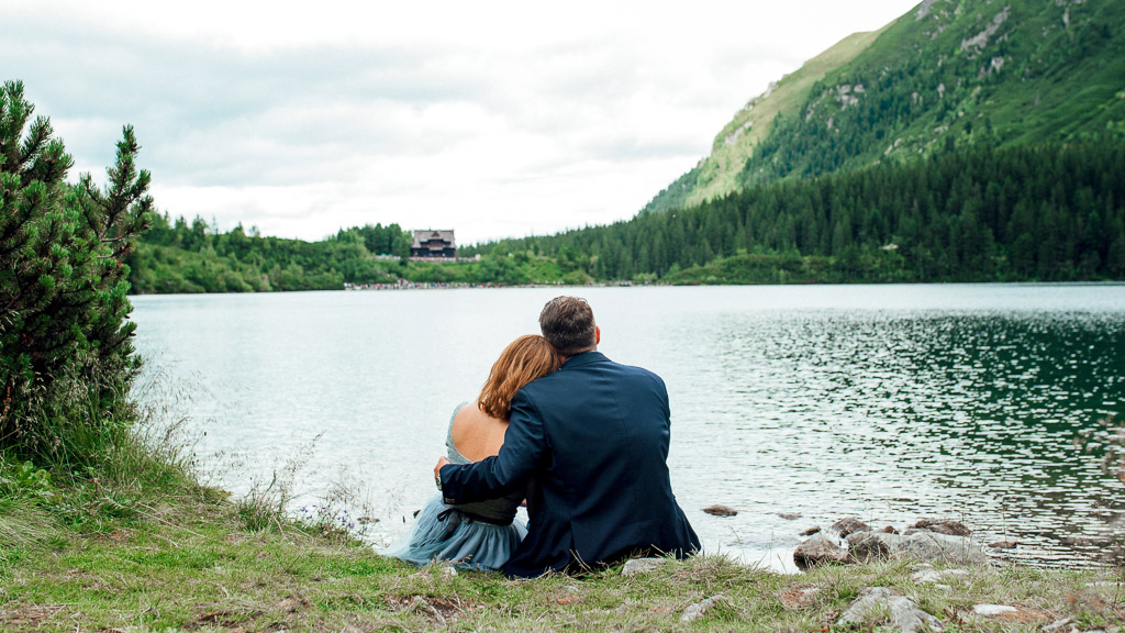A reflective man sitting with calm presence beside a partner